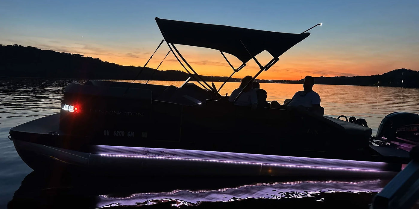 Lit Up Pontoon Boat at Night